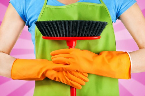 Cleaner checking the area during a carpet risk assessment